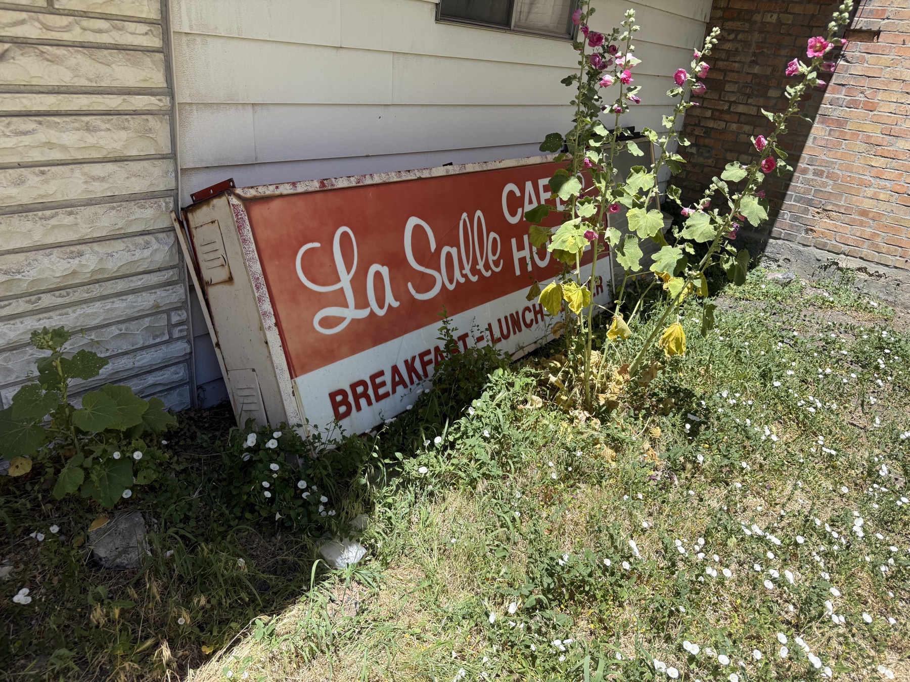 The original hand-painted La Salle Cafe & Hotel sign — Breakfast, Lunch, Dinner